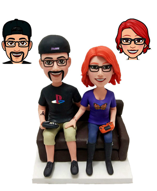 Custom cake topper couple sitting on sofa playing games